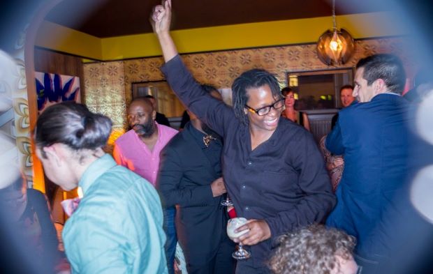 Mickalene Thomas dancing at her art-bar installation, Better Days, at Art Basel, 2013