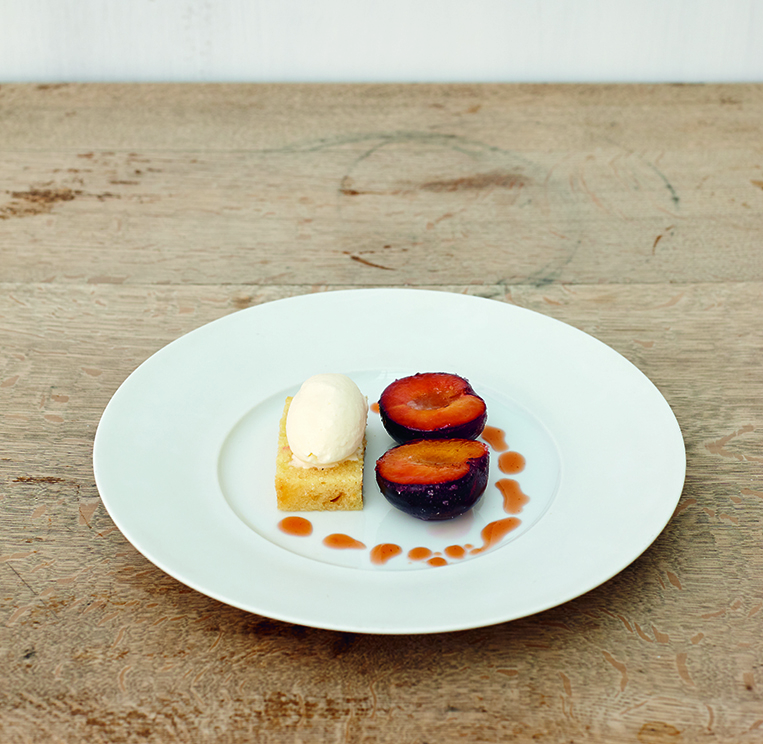 Grilled plums with plum stone ice cream and brioche, as featured in The Sportsman. The recipe features heavy, double cream