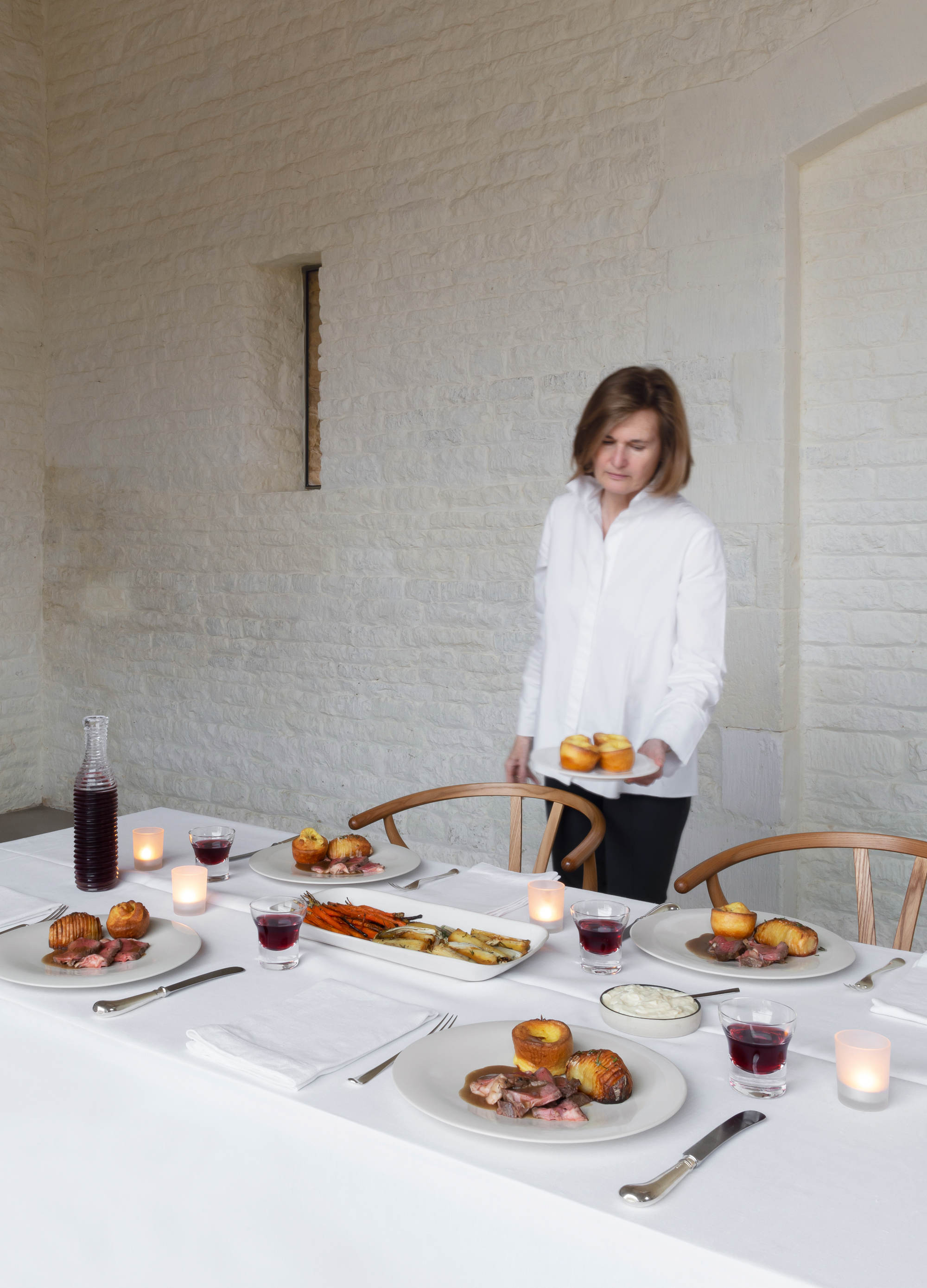 Catherne Pawson serving roast rib of beef with Yorkshire puddings and horseradish sauce. Photography by Gilbert McCarragher