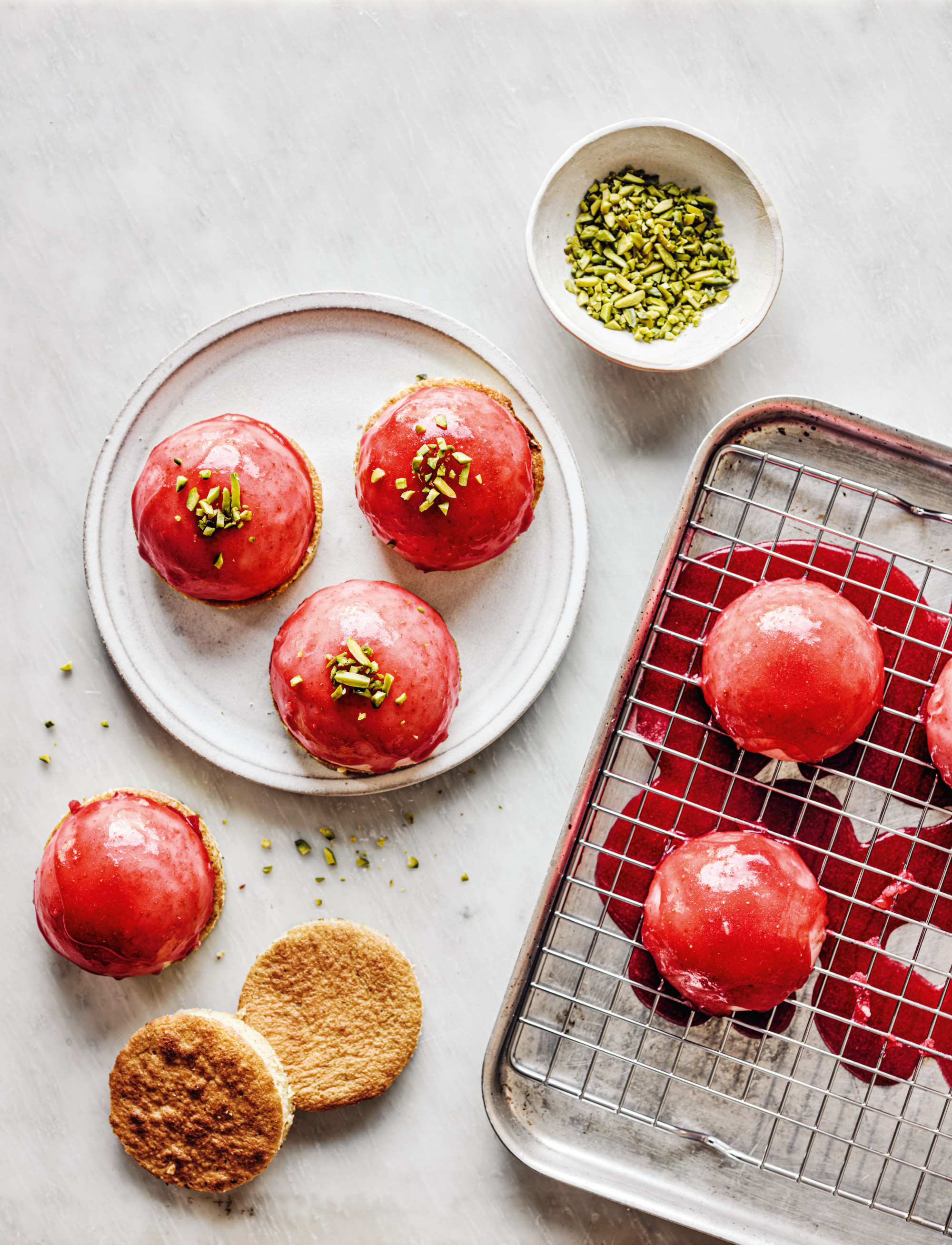 Strawberry mousse on pistachio sponge, glazed with gelatin