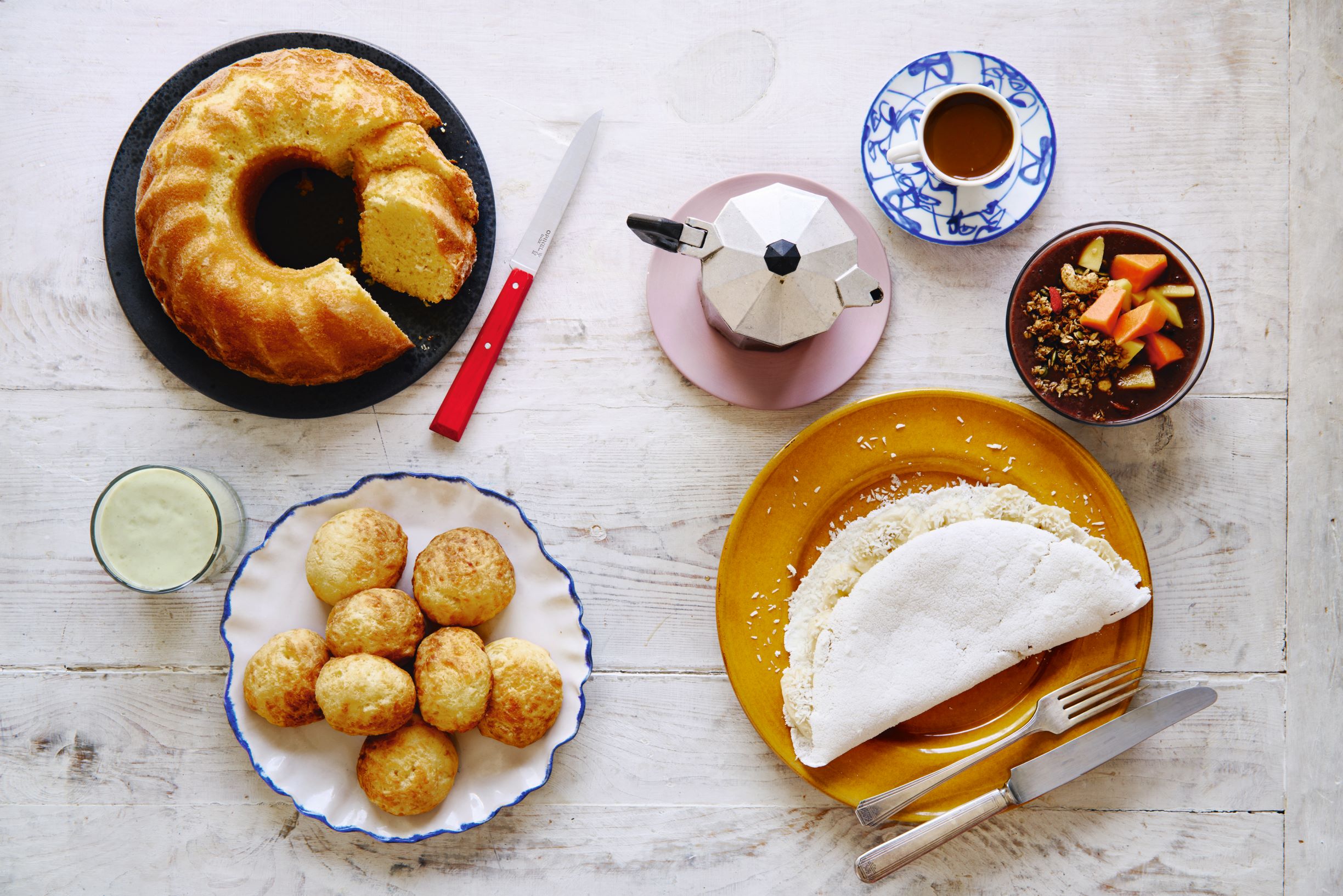 Clockwise from top left: orange pound cake; stoveto espresso; acaí bowl; apioca-flour crepe;  cheese bread; avocado smoothie; all part of the Brazilian dishes in Breakfast: The Cookbook