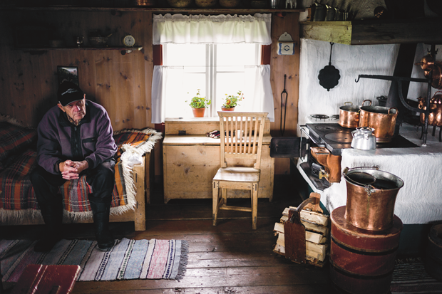 Man thinking about something and interior of traditional north Swedish mountain farm house, Summer 2014, by Magnus Nilsson. From The Nordic Cookbook