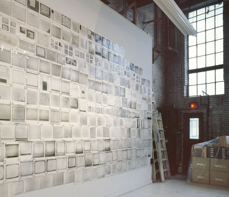 A wall of photographs in the artist’s studio, New York, 1999. Photograph by Bill Jacobson