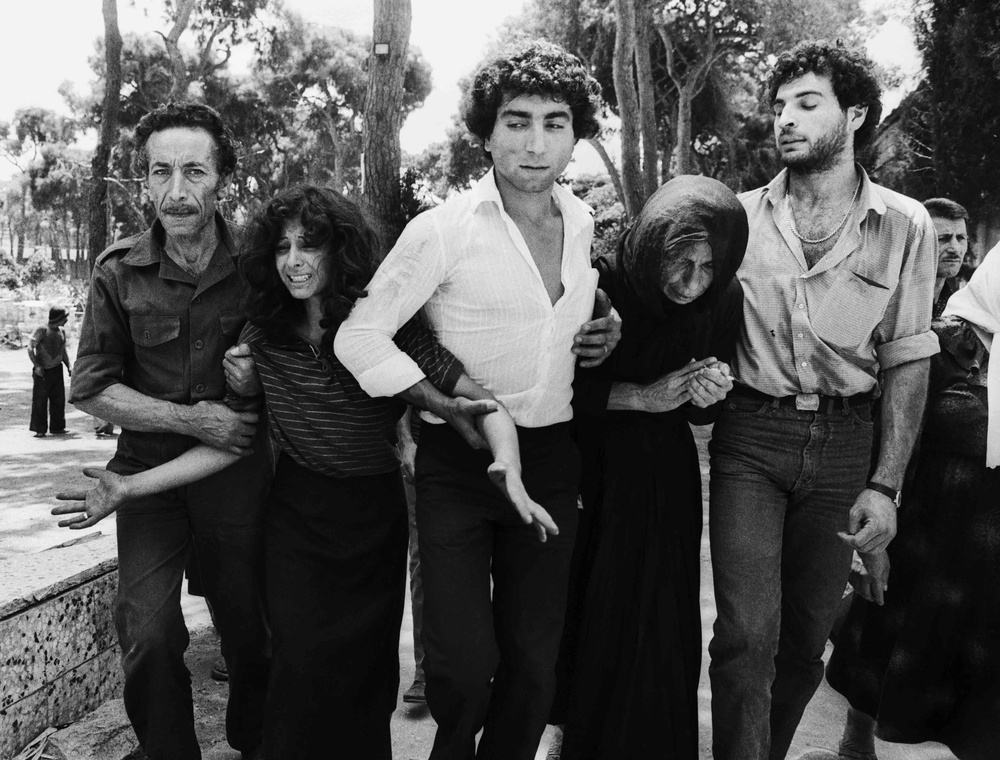 A Lebanese Family Leaving the Martyrs Cemetery, Beirut, 1982, by Don McCullin