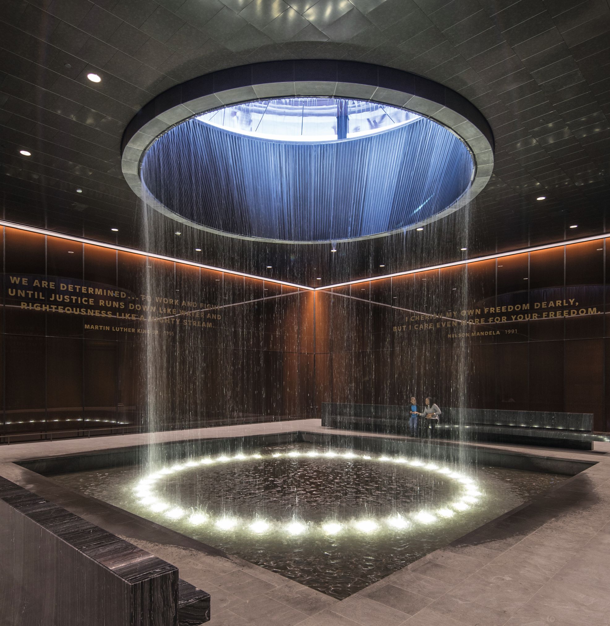 Smithsonian National Museum of African American History and Culture, Washington, D.C., USA. Freelon Adjaye Bond/SmithGroup (2016). Image courtesy of OTTO. The NMAAHC’s “Contemplative Court” features a meditative cylindrical fountain that rains into a pool in the center of the room