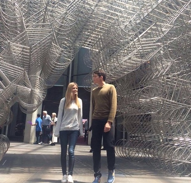 Milos Raonic walks beneath Ai Weiwei's Forever sculpture at the National Gallery of Victoria in Melbourne. Image courtesy of Raonic's Instagram.