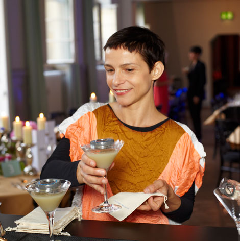 Artist Ana Prvacki pictured with the cocktails she created at Art Basel 2014