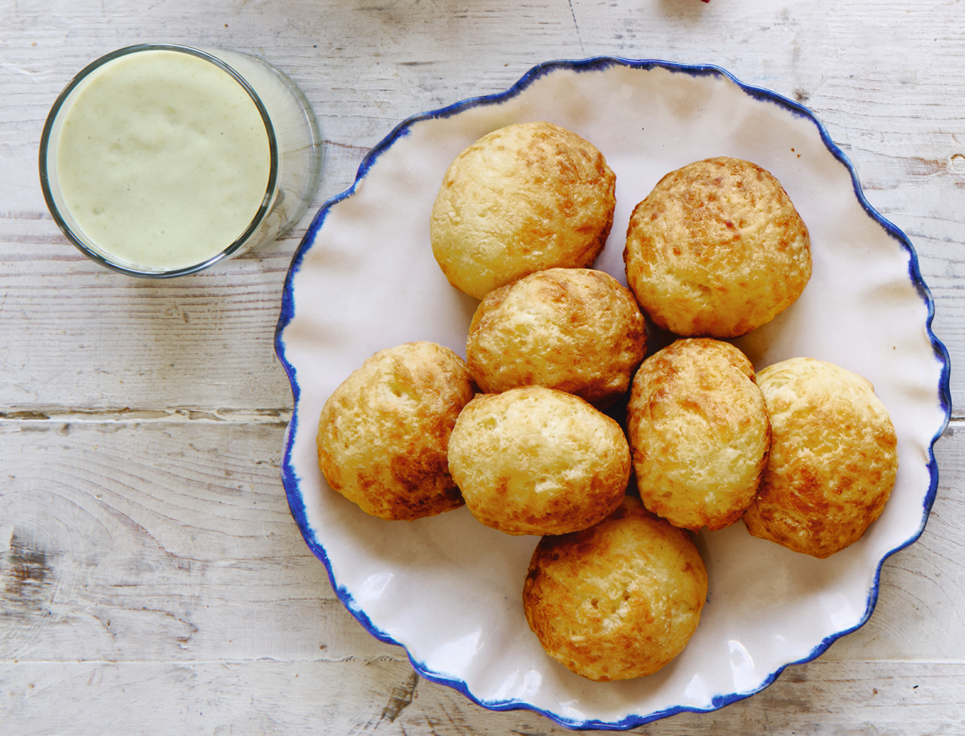 Avocado smoothie, beside cheese bread, from Breakfast: The Cookbook