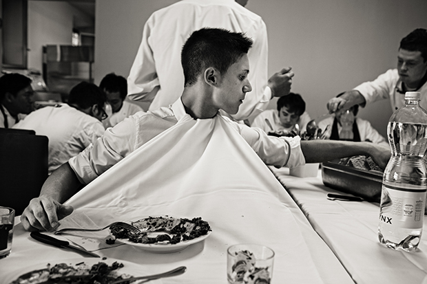 A waiter keeps his shirt clean at Osteria Francescana, Modena, Italy. From Eating With the Chefs by Per-Anders Jörgensen