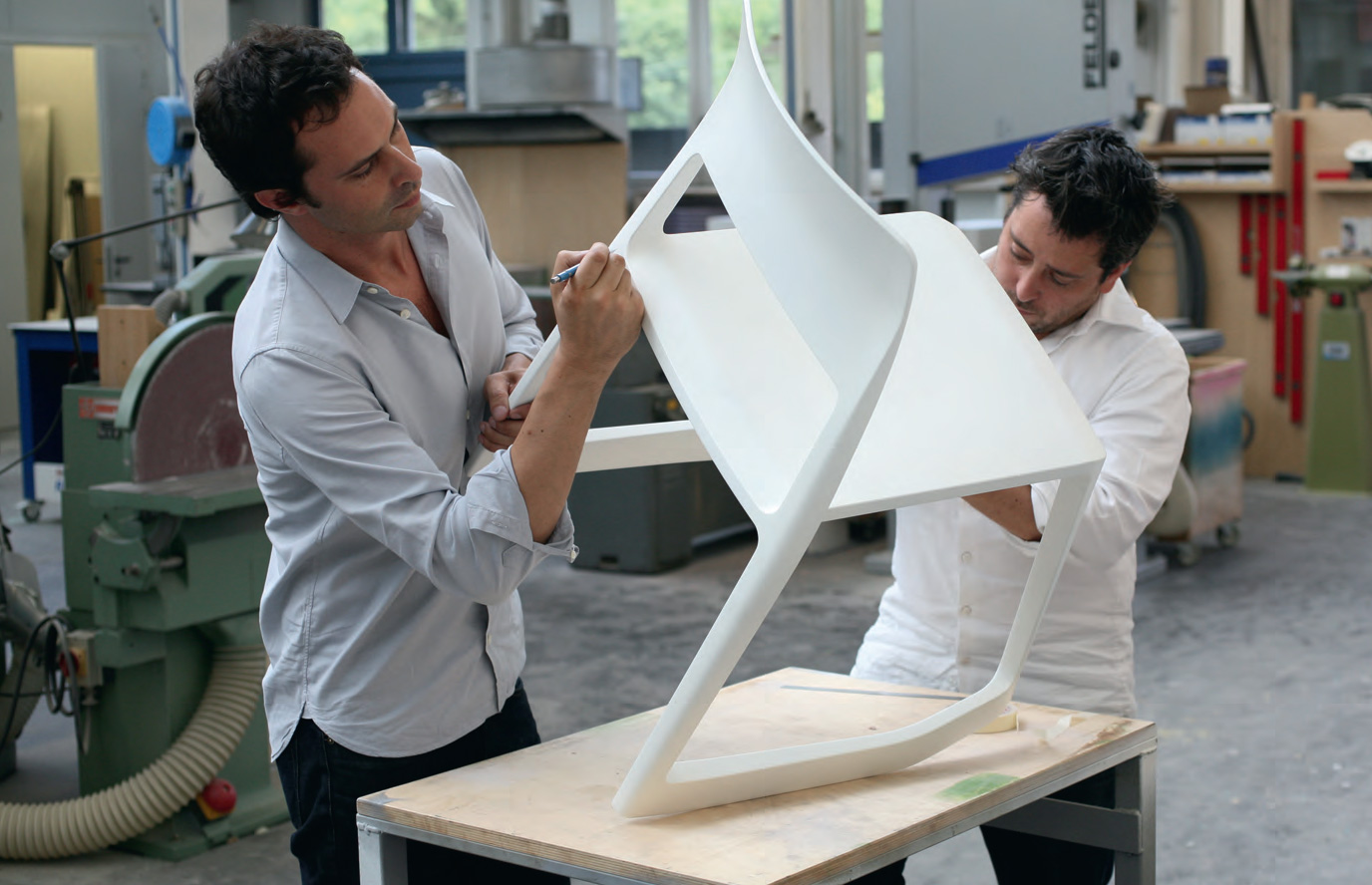 Edward Barber and Jay Osgerby working on their Tip Ton chair, Vitra workshops, Basel, Switzerland, 2010
