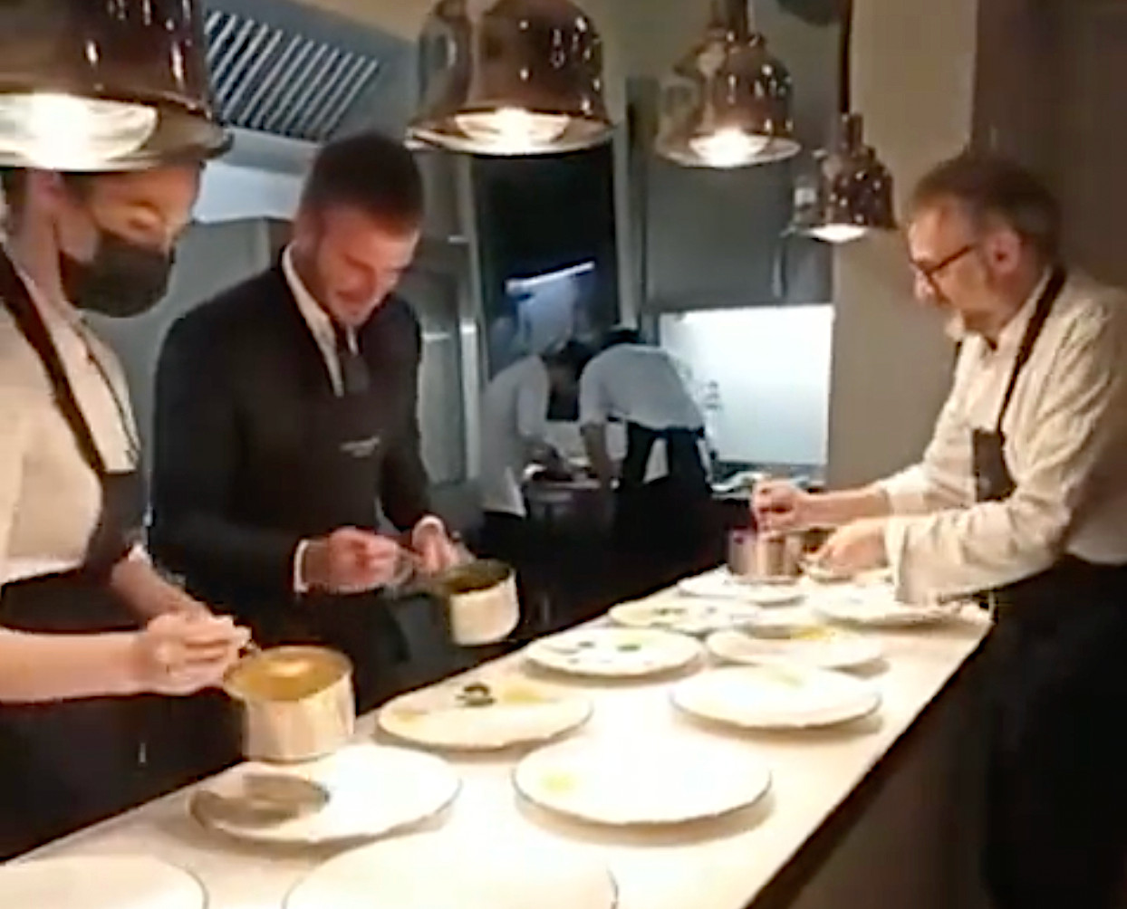 Bottura and Beckham plating up together. A still from Massimo's Instagram video