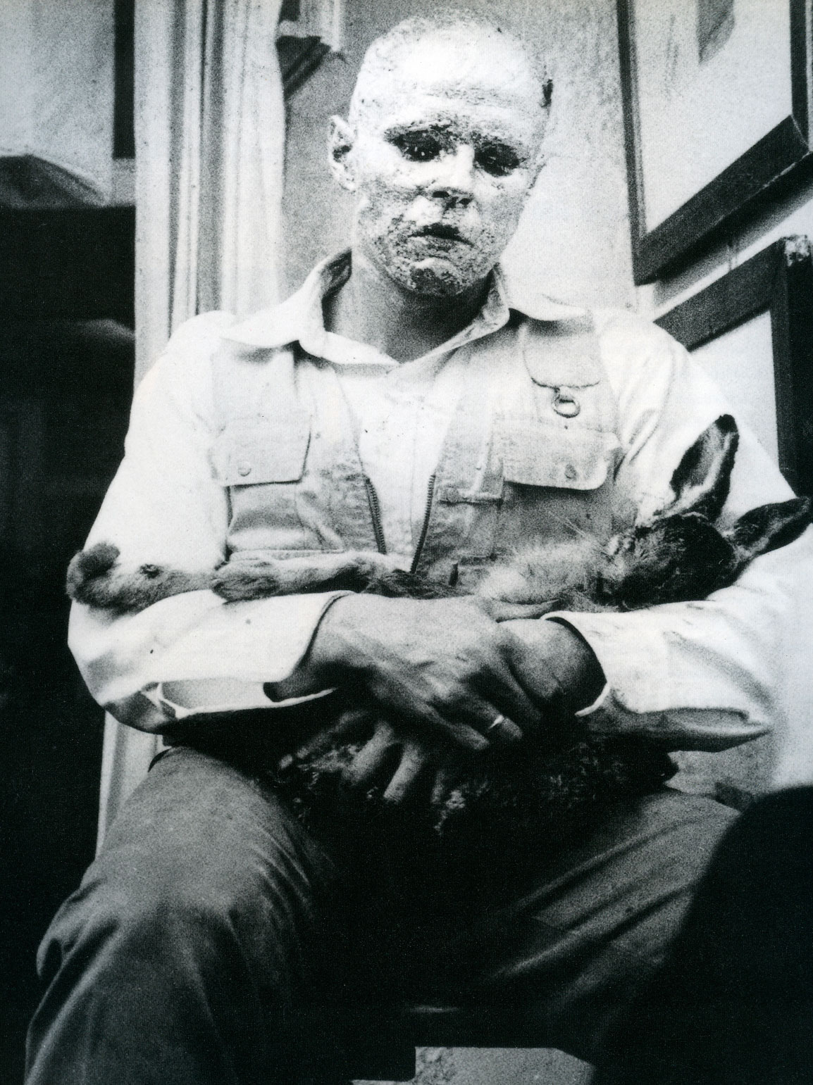 Beuys during his Action How to Explain Pictures to a Dead Hare (Wie man dem toten Hasen die Bilder erklärt), Schelma Gallery, Dusseldorf, 26 November 1965