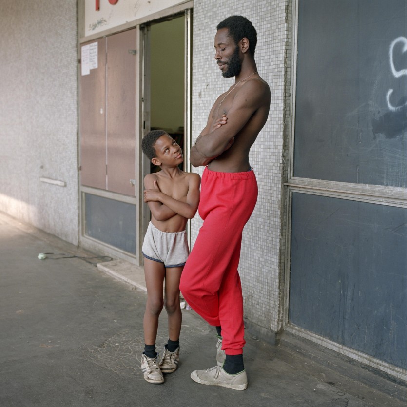 Bill Stephenson, ‘Tony the Ton’ and Martin age 8, outside the Pop In Centre. Hyde Park Flats, Sheffield, 1988 © Bill Stephenson. Image courtesy of S1 Artspace