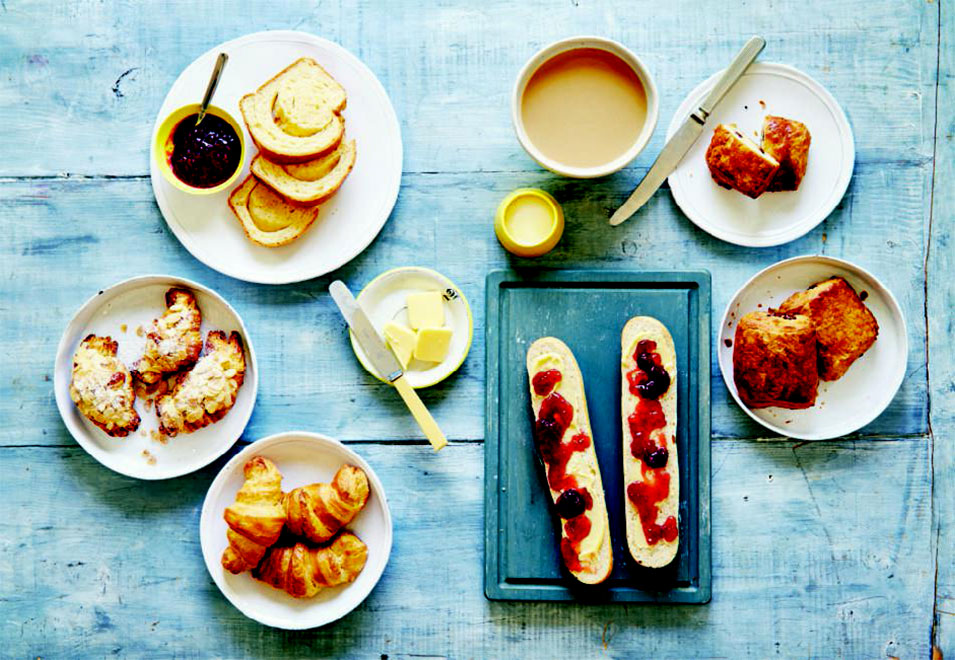 Clockwise from top left: brioche; café au lait; pains au chocolat; tartine; croissants; almond croissants, from the French pages of Breakfast: The Cookbook
