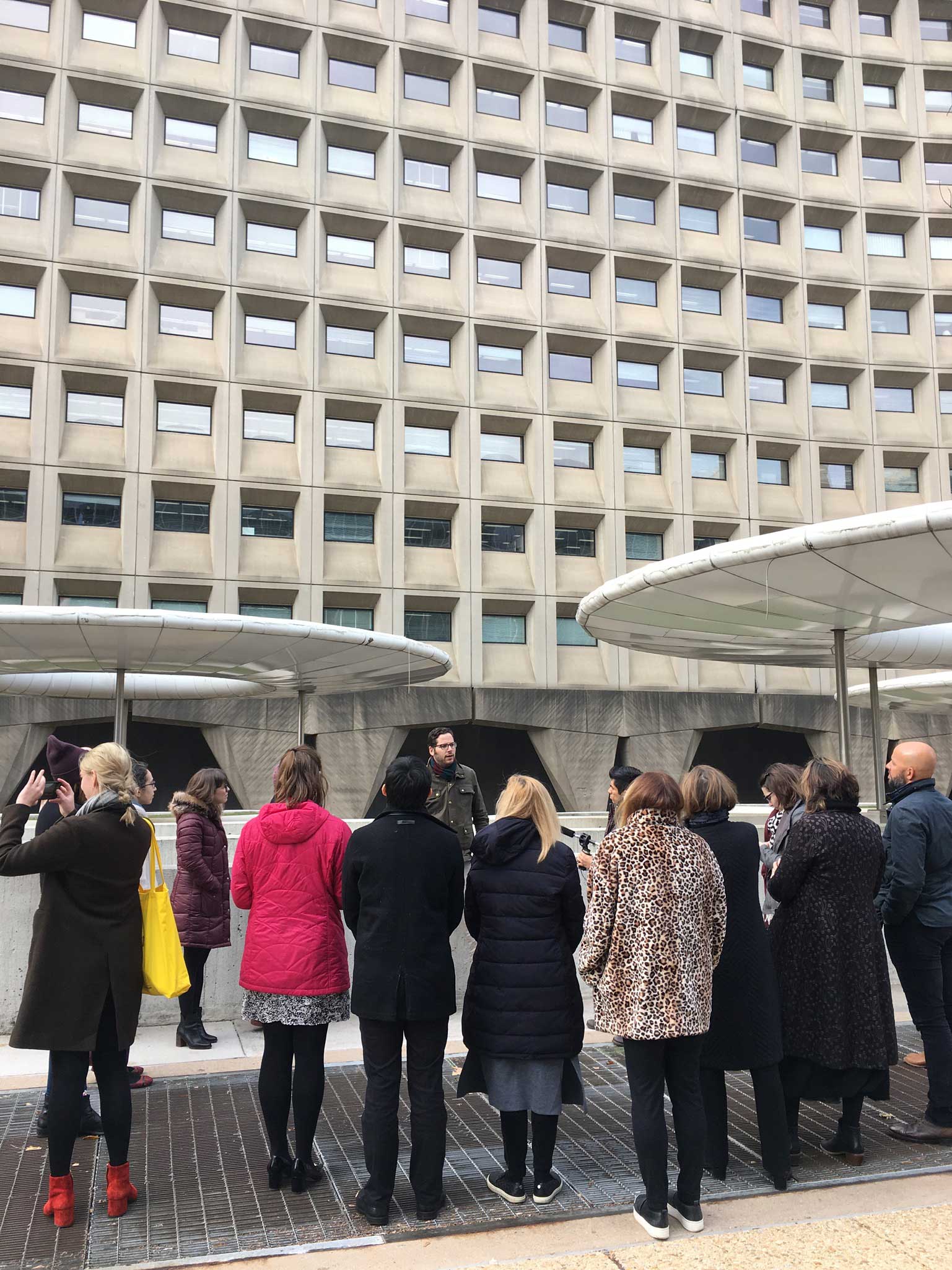 Sam Lubell talks to Brutalist bus tour attendees