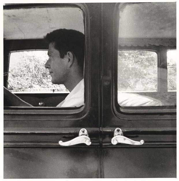 John Cage in his Model A car at Black Mountain College. Photo by Robert Rauschenberg