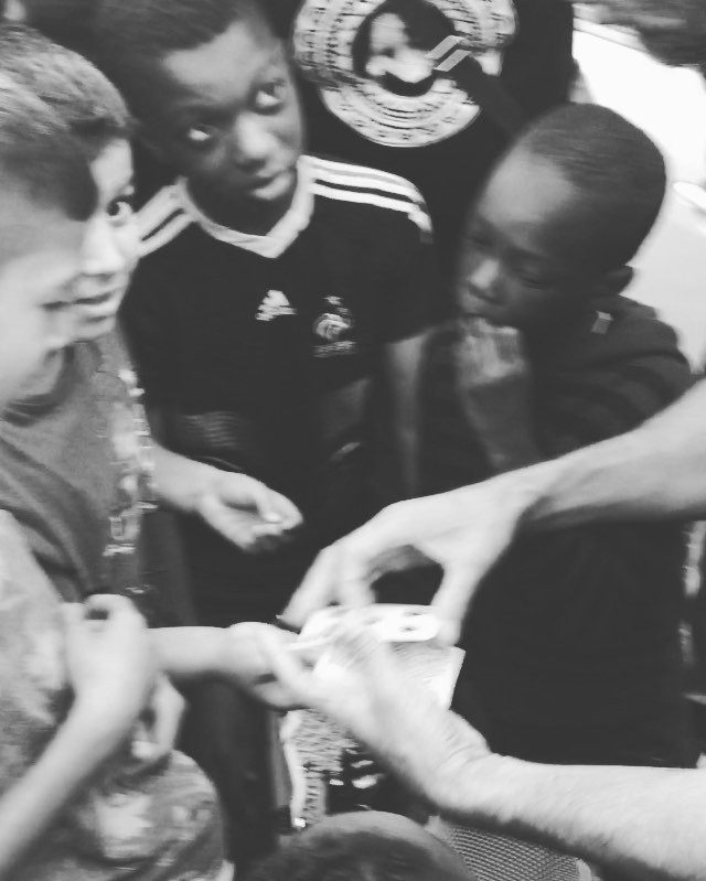 David Blaine performs card tricks at the premier of Les Bosquets. Image courtesy of JR's Instagram