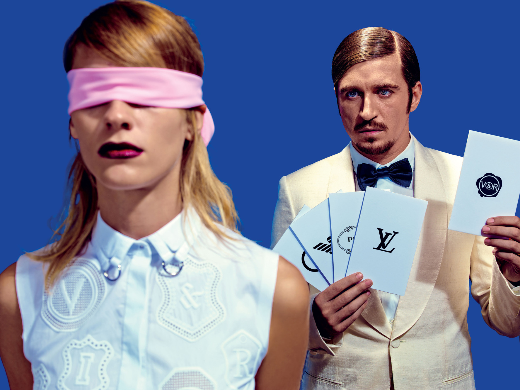 On her: shirt, Viktor & Rolf. On him: suit, shirt, and tie, Louis Vuitton. Shot by Maurizio Cattelan and Pierpaolo Ferrari for New York Magazine 
