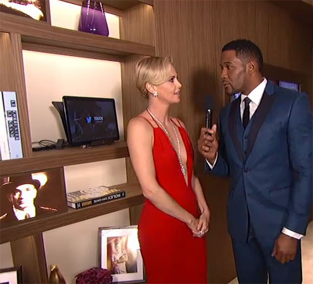 Charlize Theron speaking to ABC’s Michael Strahan in the Oscars green room, at the 88th Academy Awards, February 2016