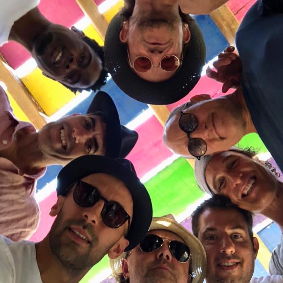 JR (bottom left) with Bono, Chris Rock, Ali Hewson, Matthew McComaughey, Guy Oseary, Woody Harrelson, Lars Ulrich and Sacha Baron Cohen. Image courtesy of Château La Coste's Instagram