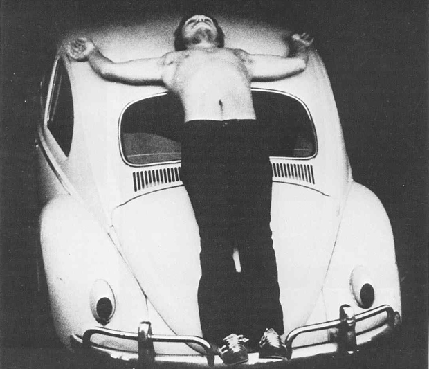 Chris Burden performing Trans-Fixed in 1974