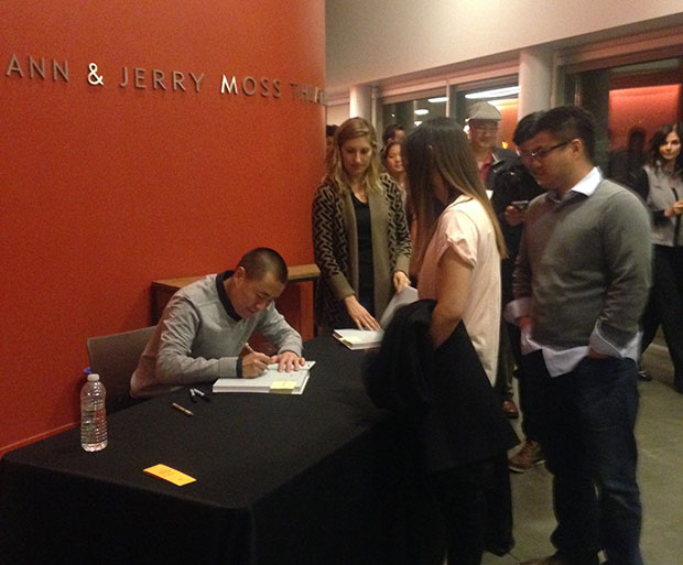 Corey signs a copy of Benu for a lucky guest