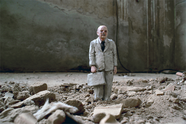 One of Isaac Cordal's cement figures stands alone