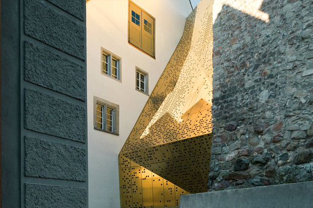 Architects :mlzd create perforated bronze museum 