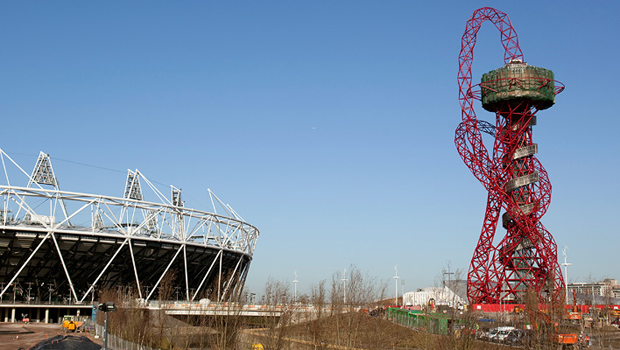 Anish Kapoor's 'Orbit Tower' in the final stages of its construction with the London 2012 Olympic Stadium to its left