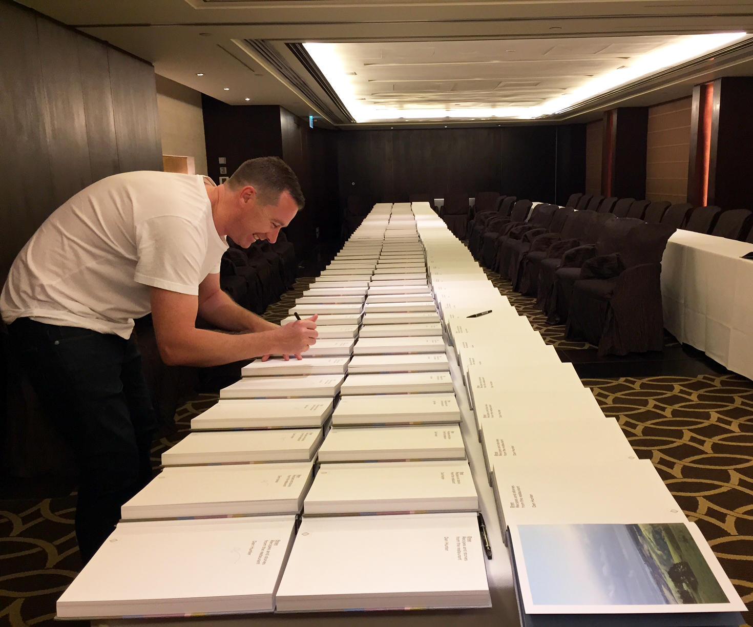 Dan Huner signing copies of his book Brae over in Hong Kong