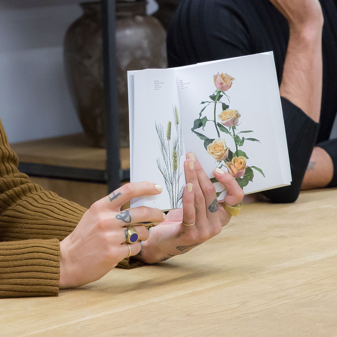 Darroch holds a copy of their new book