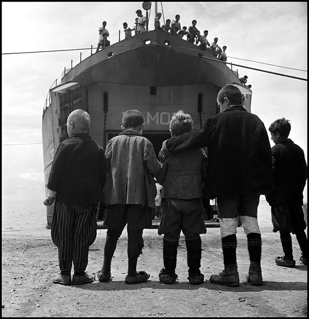 Five boys from Promahi in front if the refugee ship S.S Samos that evacuated children during the Civil War. Greece, 1948 © David Seymour / Magnum Photos