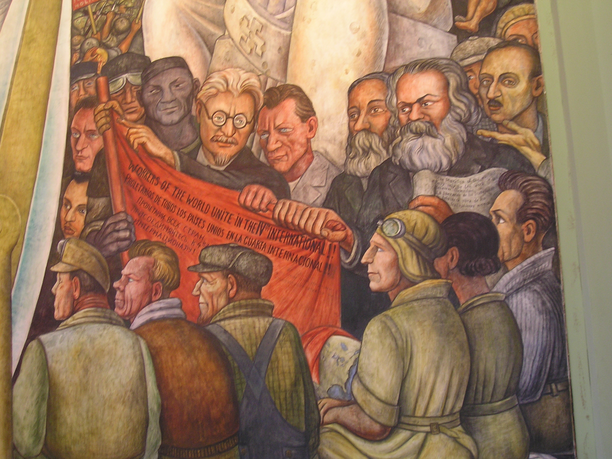 Trotsky (alongside Karl Marx and Friedrich Engels) as depicted in Rivera's 1934 painting