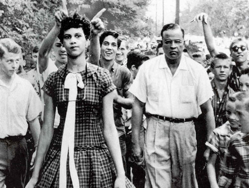 Dorothy Courts enters a newly desegregated school, 1957m by Douglas Martin. As reproduced in The Photography Book