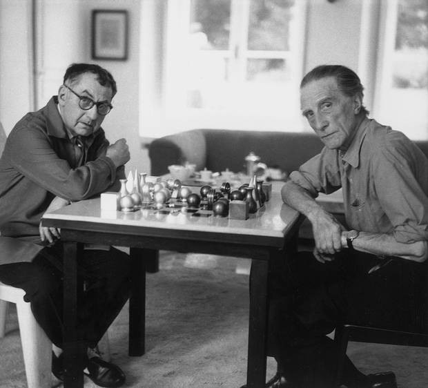 Man Ray and Marcel Duchamp playing chess with Man  Ray's chess set