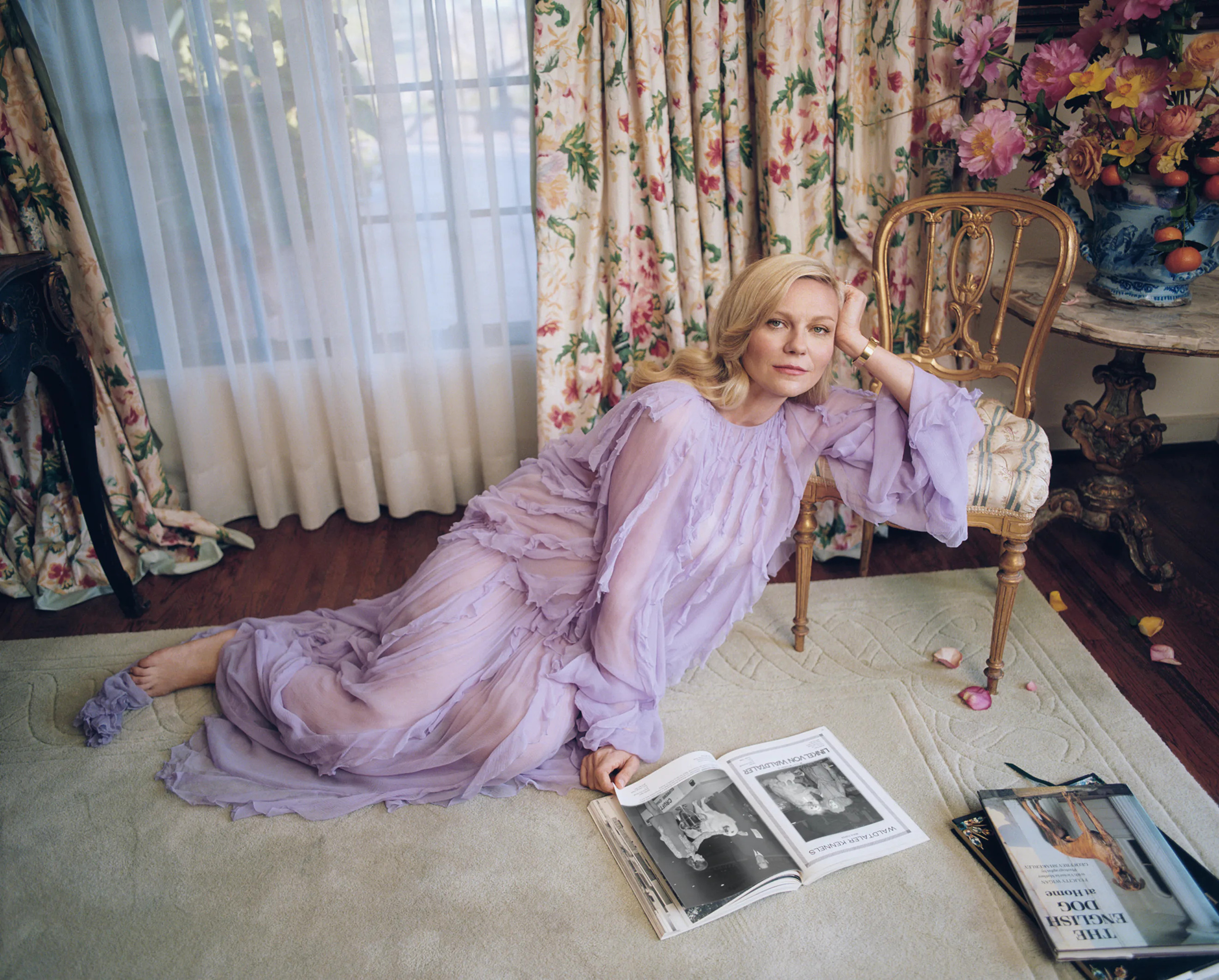 Kirsten Dunst beside the Putnams' floral display in the new W Magazine. Photograph by Zoë Ghertner. Dunst wears a Valentino dress; Beladora bracelet; her own ring