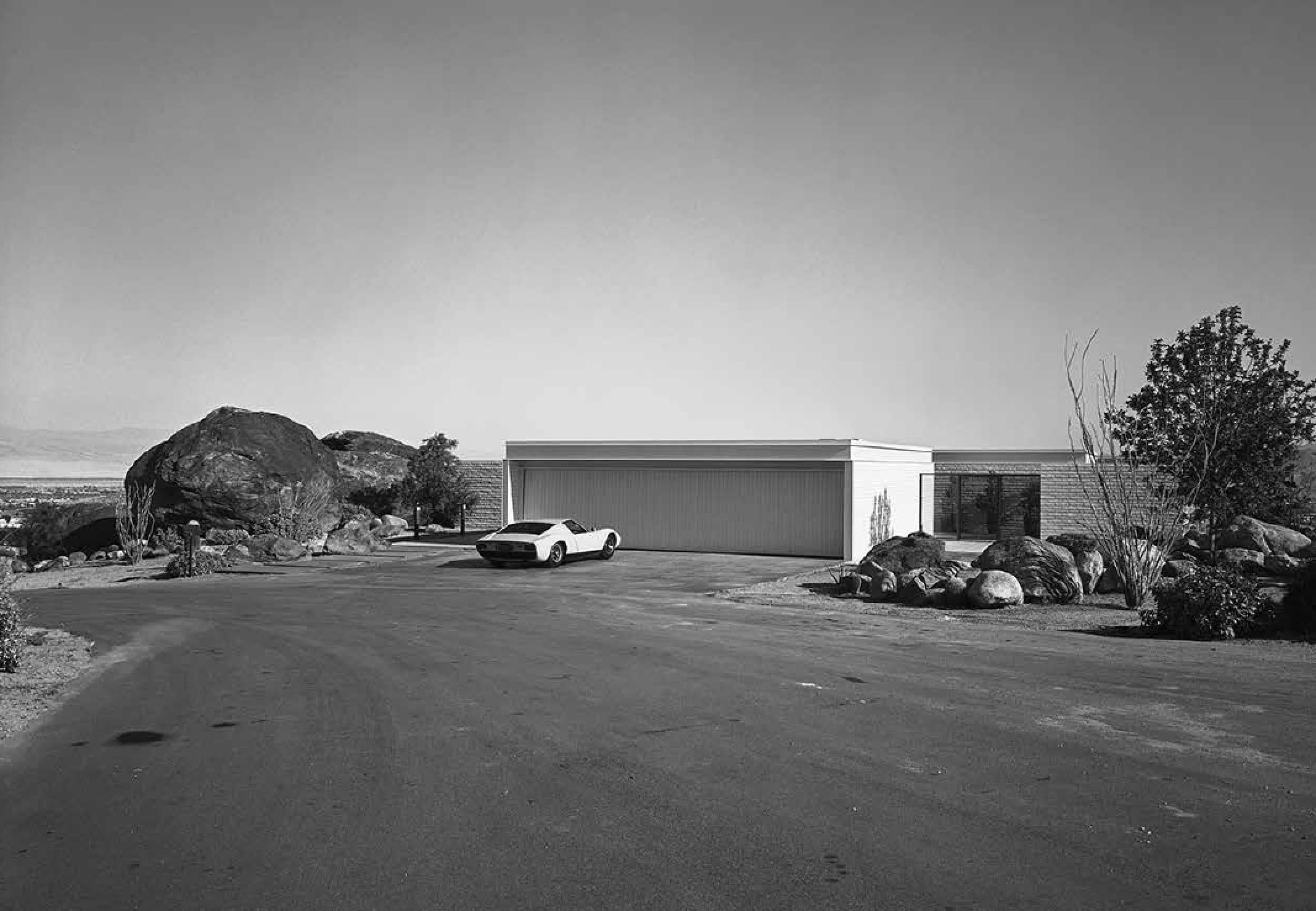 The Palevsky House - architect Craig Ellwood’s second commission from Max Palevsky as featured in California Captured Mid-Century Modern Architecture featuring the photographs of Marvin Rand. Rand snapped the car parked in Palevsky’s driveway after one of their drives together. (Less visible is Ellwood’s personalized license plate: VRRRRRM).
