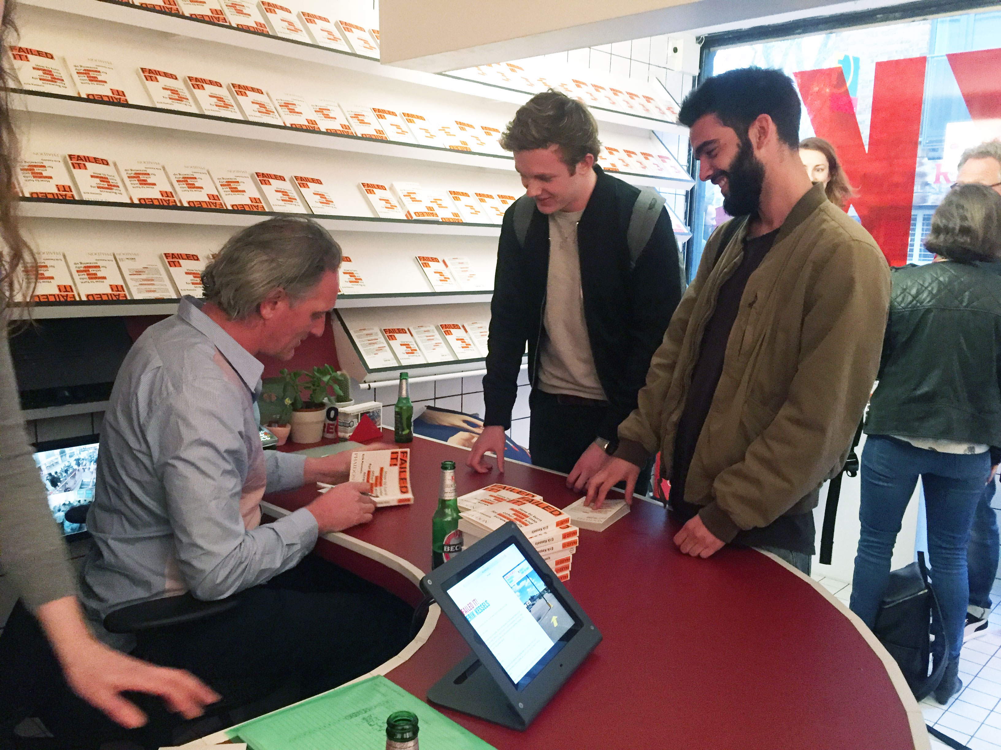 Erik signing copies of his book at the KK Ouytl