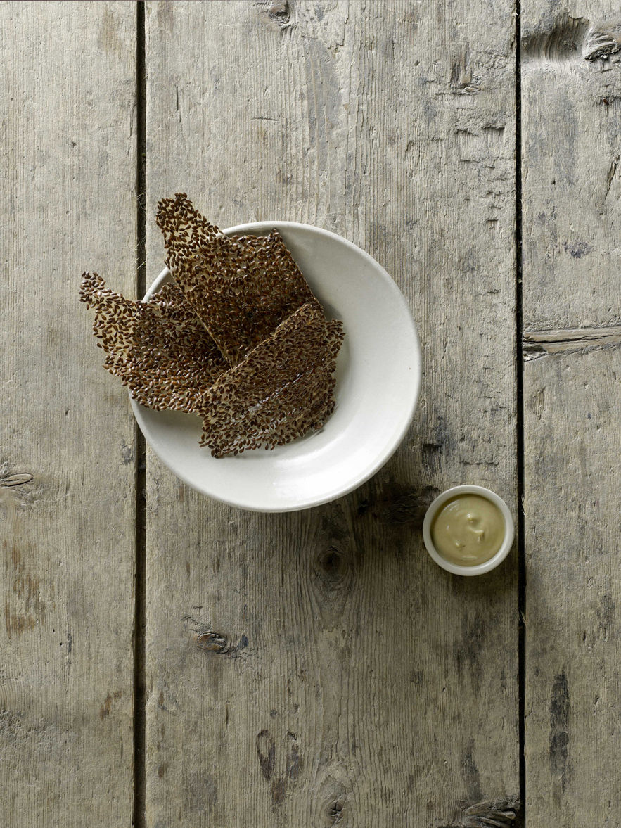 Linseed and vinegar crisps, mussel dip. Photograph by Erik Olsson