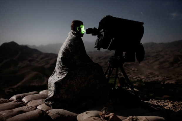 Adam Ferguson - Wardak, Afghanistan 2009. A US soldier surveys a road with a long range acquisition sight