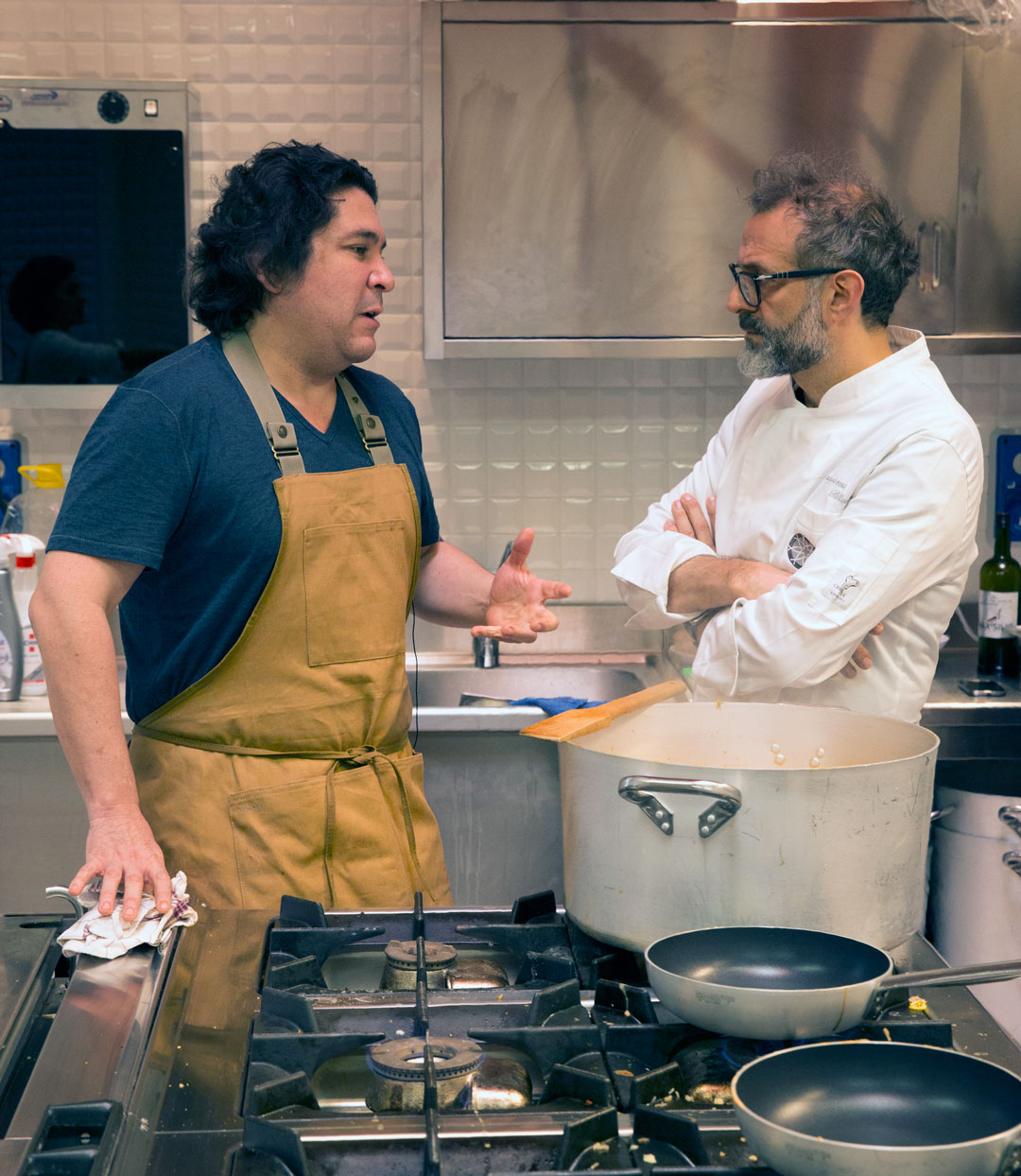 Gastón Acurio and Massimo Bottura at Refettorio Ambrosiano, as reproduced in Bread is Gold