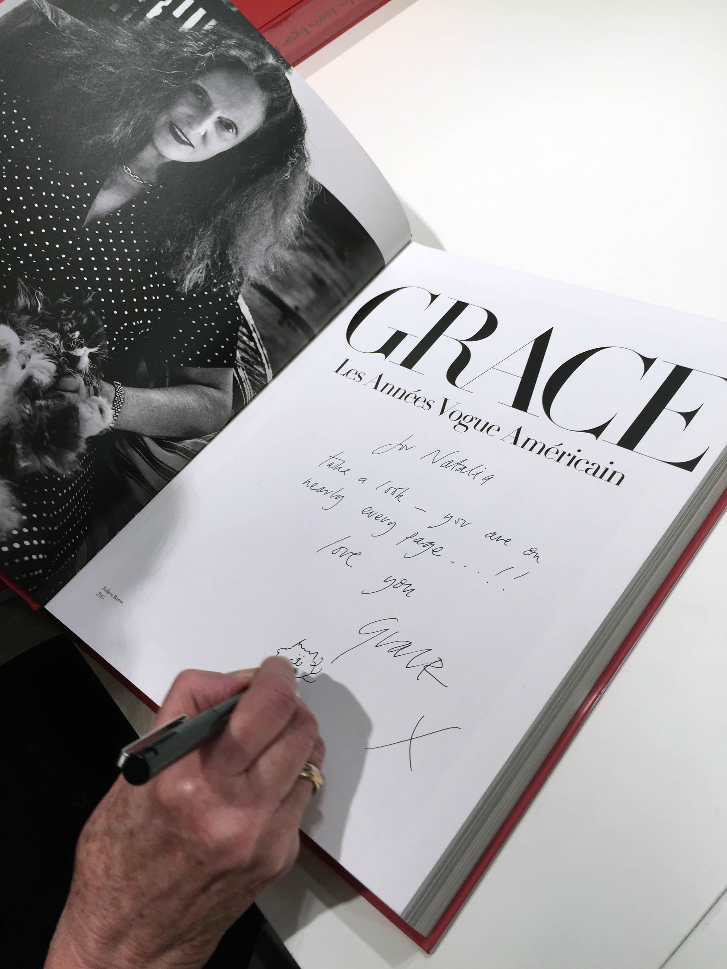 Grace Coddington inscribes Natalia Vodianova's book at Colette, Paris, 2016