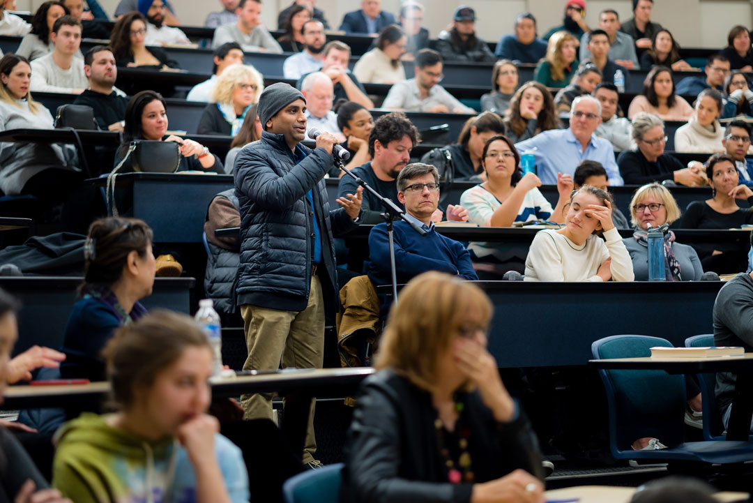 An audience member asks a question