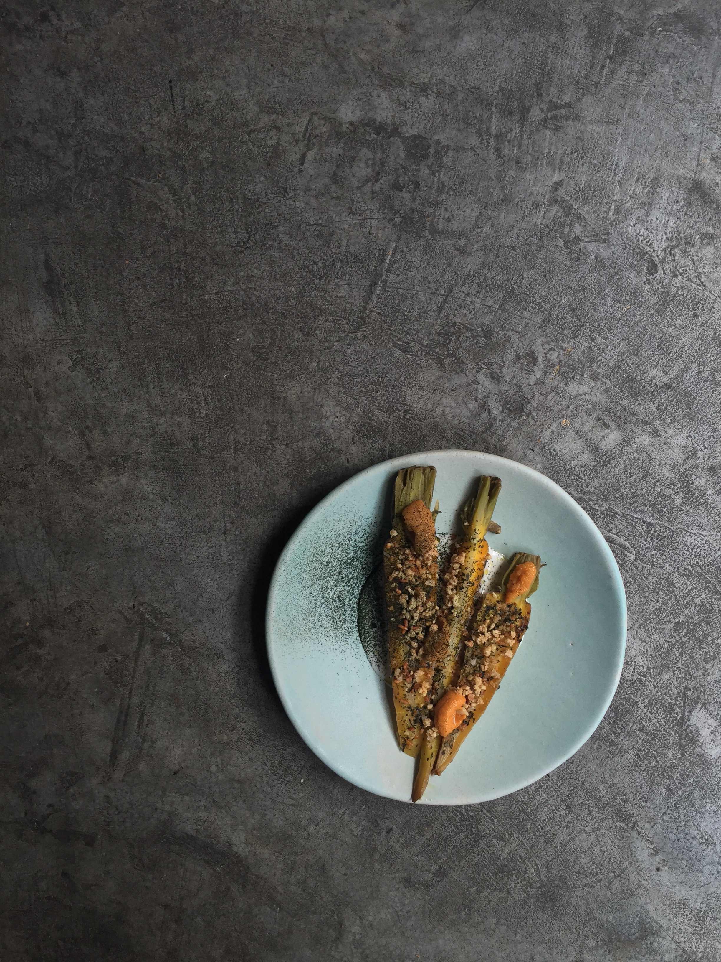 Hay roasted carrots, genmaicha squash sauce, uni. Image courtesy of Contra