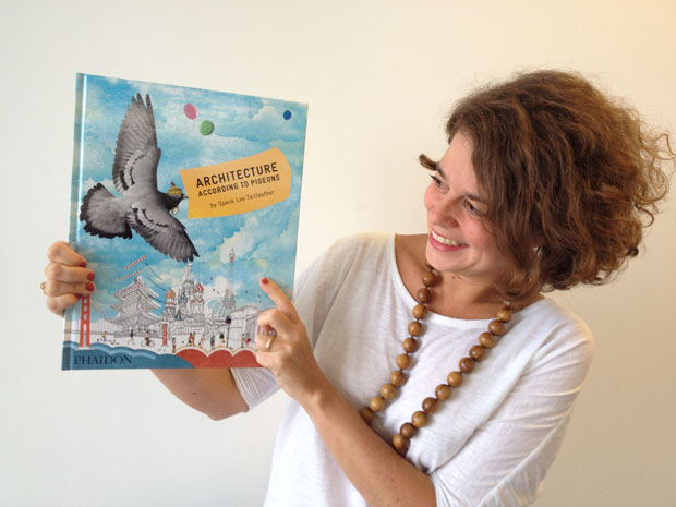 Phaidon Senior Editor of Children's Books Hélène Gallois Montbrun with a copy of Architecture for Pigeons