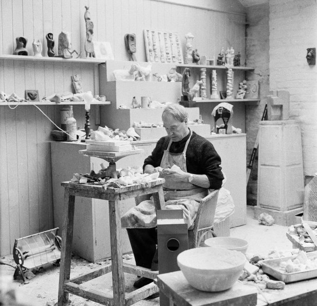 Henry Moore working on a plaster in the Maquette Studio, Perry Green, c. 1960. Photo: John Hedgecoe. Reproduced by permission of The Henry Moore Foundation.