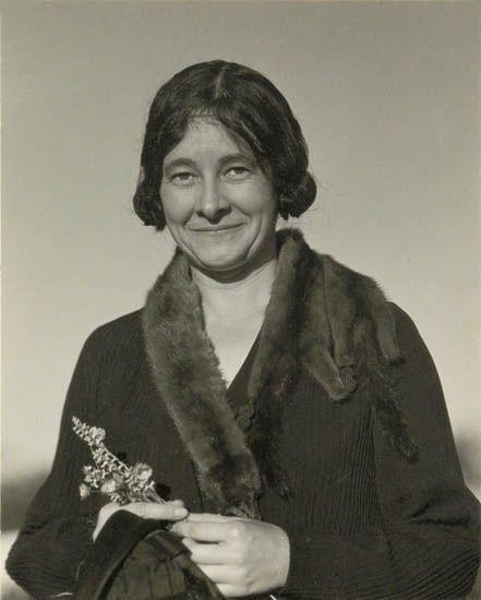 Ida O'Keeffe with flowers (1924) by Alfred Stieglitz