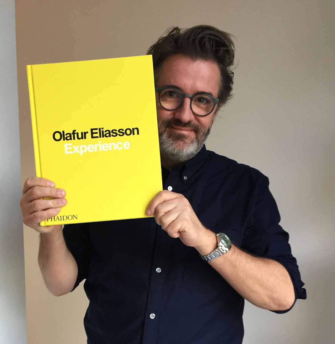 Olafur Eliasson holding a signed copy of his new book Experience. Head into the store now to buy one
