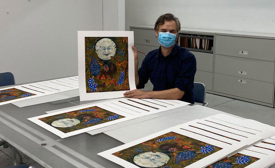Marcel Dzama with his Artspace edition, The illumination of the sisters of paradise, 2020 - photo Lower East Side Printshop, October 2020 