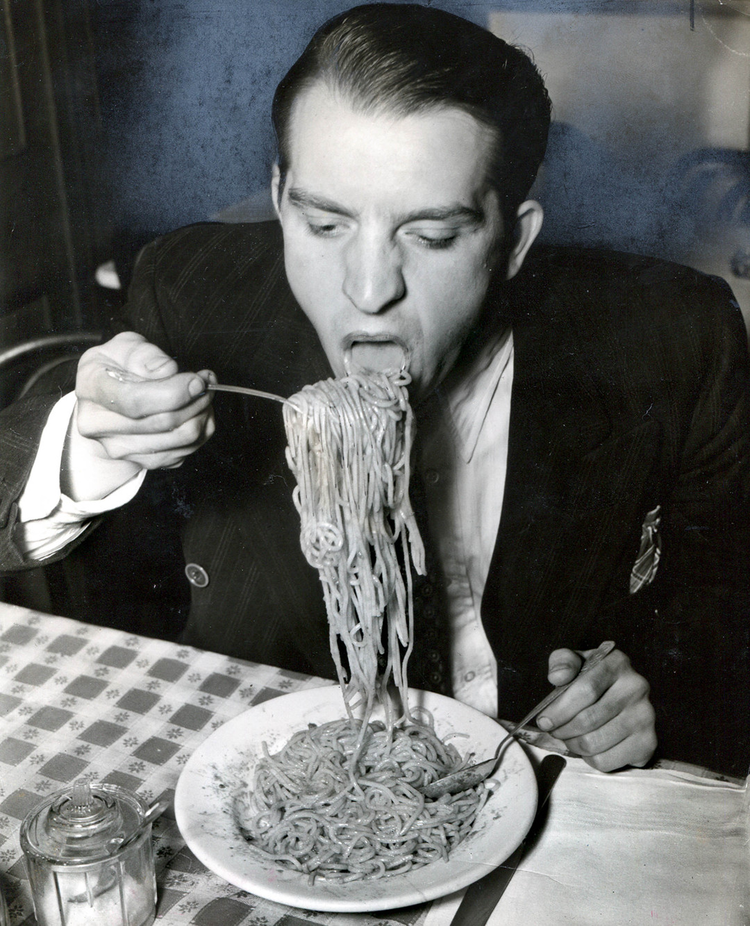 Weegee, Phillip J. Stazzone Is on WPA and Enjoys His Favourite Food as He’s Heard That the Army Doesn’t Go in Very Strong for Serving Spaghetti, 1940.